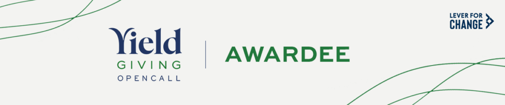 Graphic with navy and dark green text reading, 'Yield Giving Open Call Awardee.' Lever for Change text and logo featuring a right-pointing arrow in top right corner.