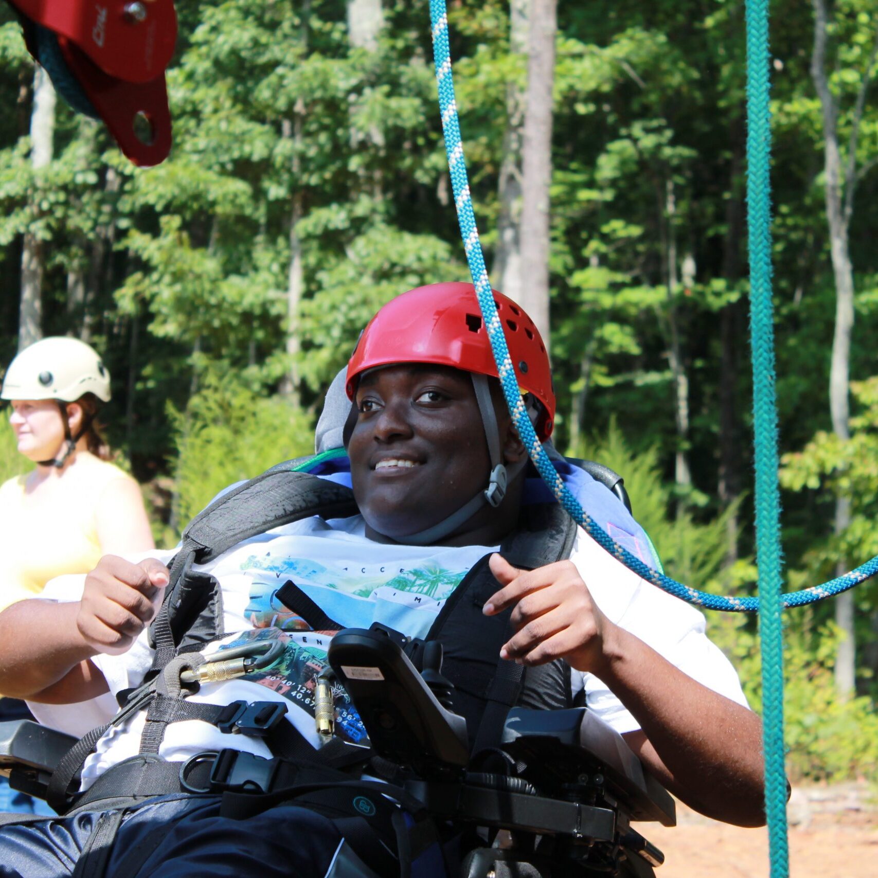 girl on outdoor course in wheelchair